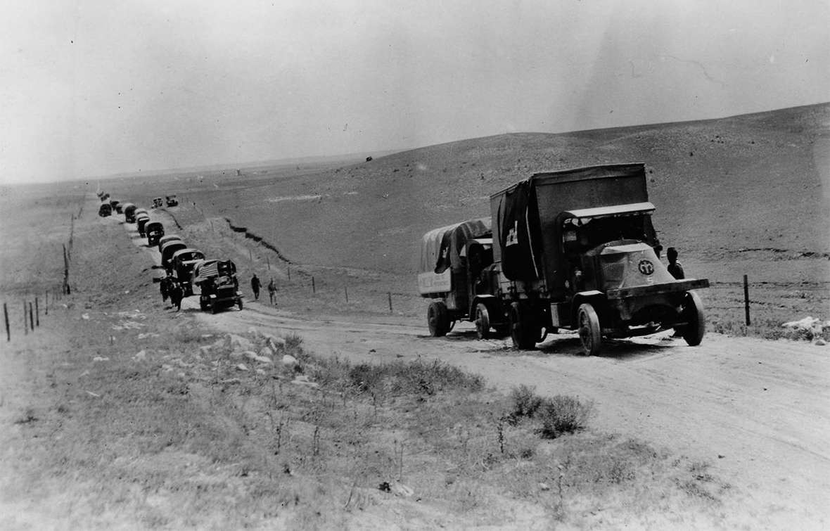 A military truck convoy crossing the American West